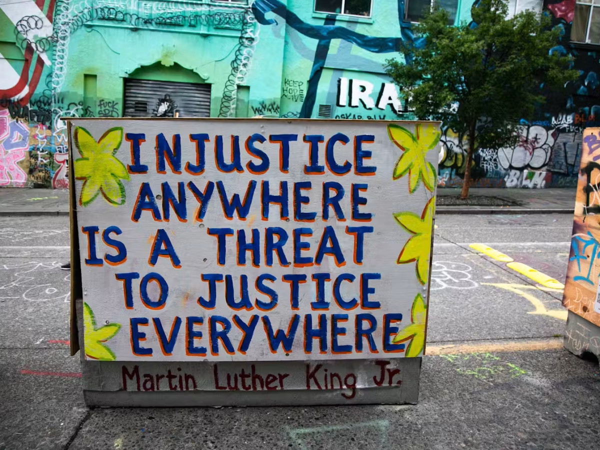 Demonstrators in Seattle painted on structures and used graffiti to express their support for social justice reform policies.