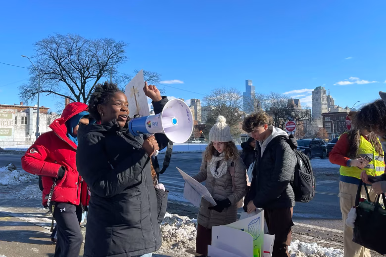 Hailee Hallman, a senior, led chants as students poured out of Cass Tech to protest ICE on Friday.